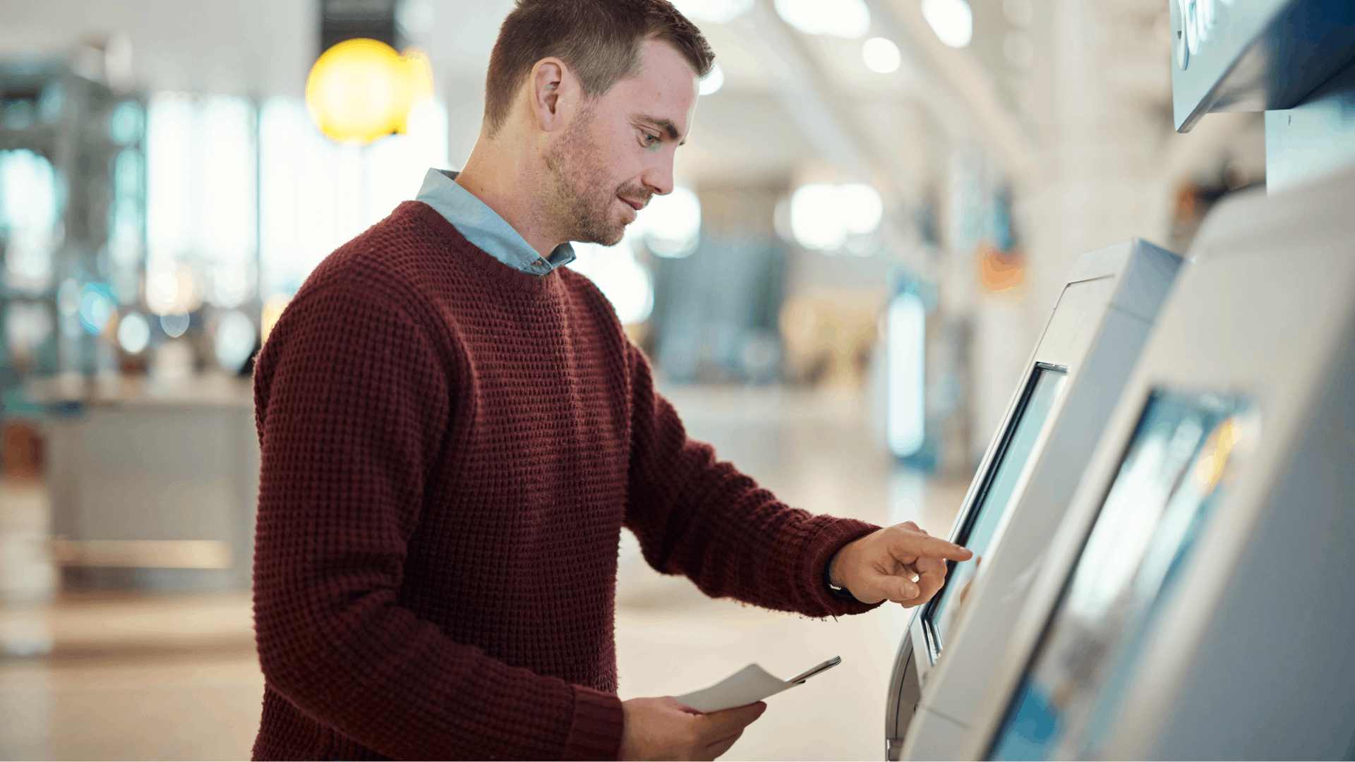 man-airport-and-self-service-for-check-in-ticket-2023-11-27-05-05-56-utc